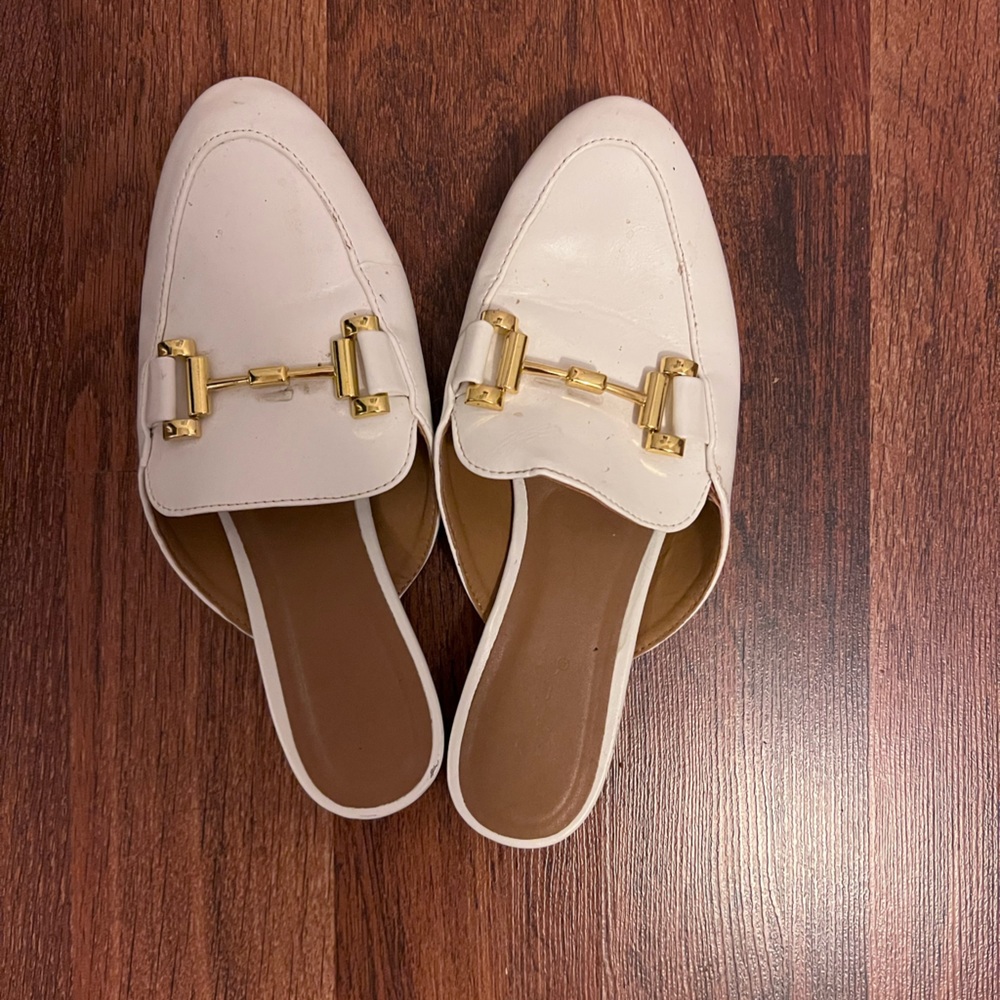 White mules with golden bit details